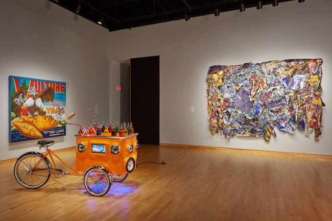 Installation view of Constant Storm exhibition at USF Contemporary Art Museum. Left to right: Art by Miguel Luciano and Angel Otero. Photo: Will Lytch.